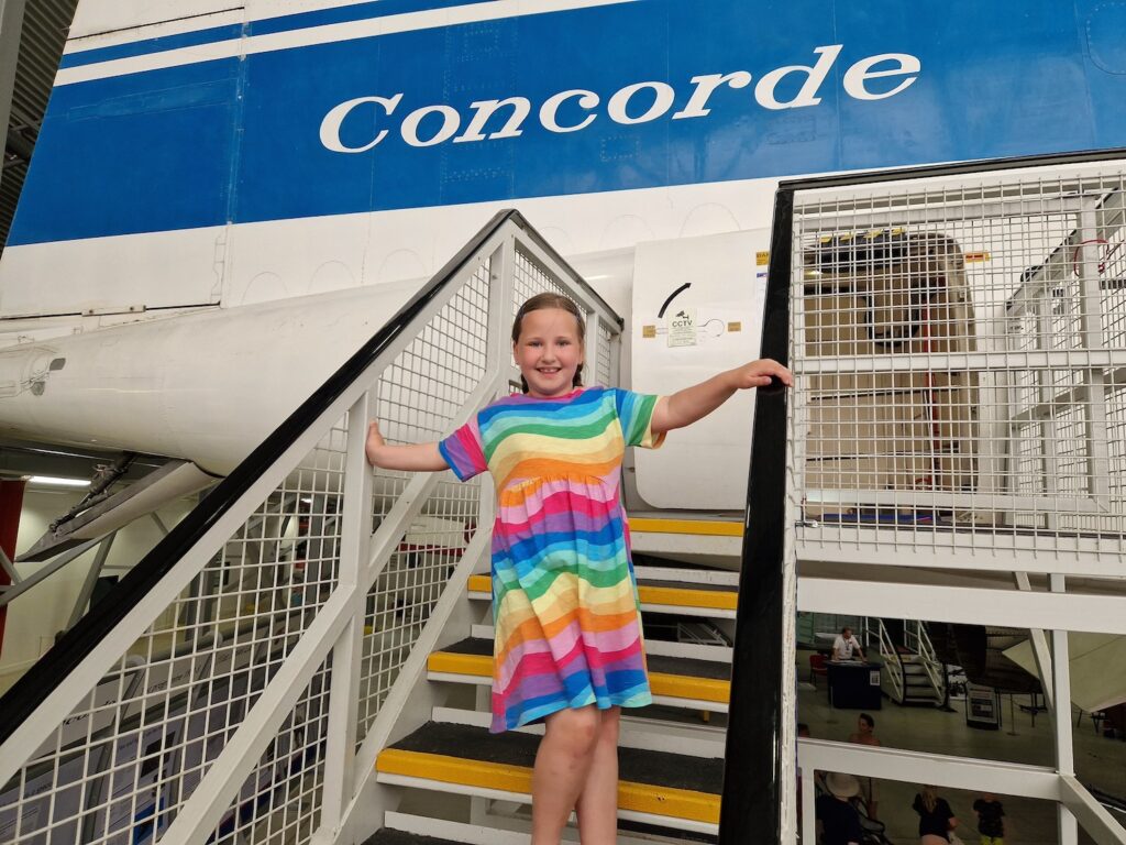 Erin in front of a Concorde aircraft