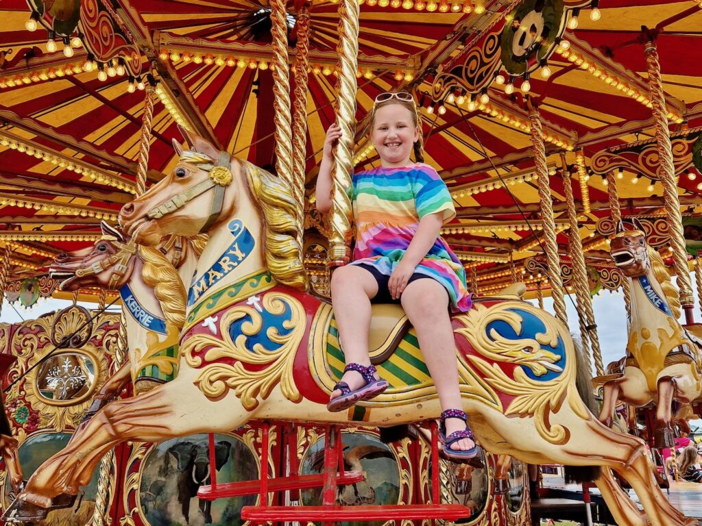 Erin on the carousel at the Duxford Summer Air Show