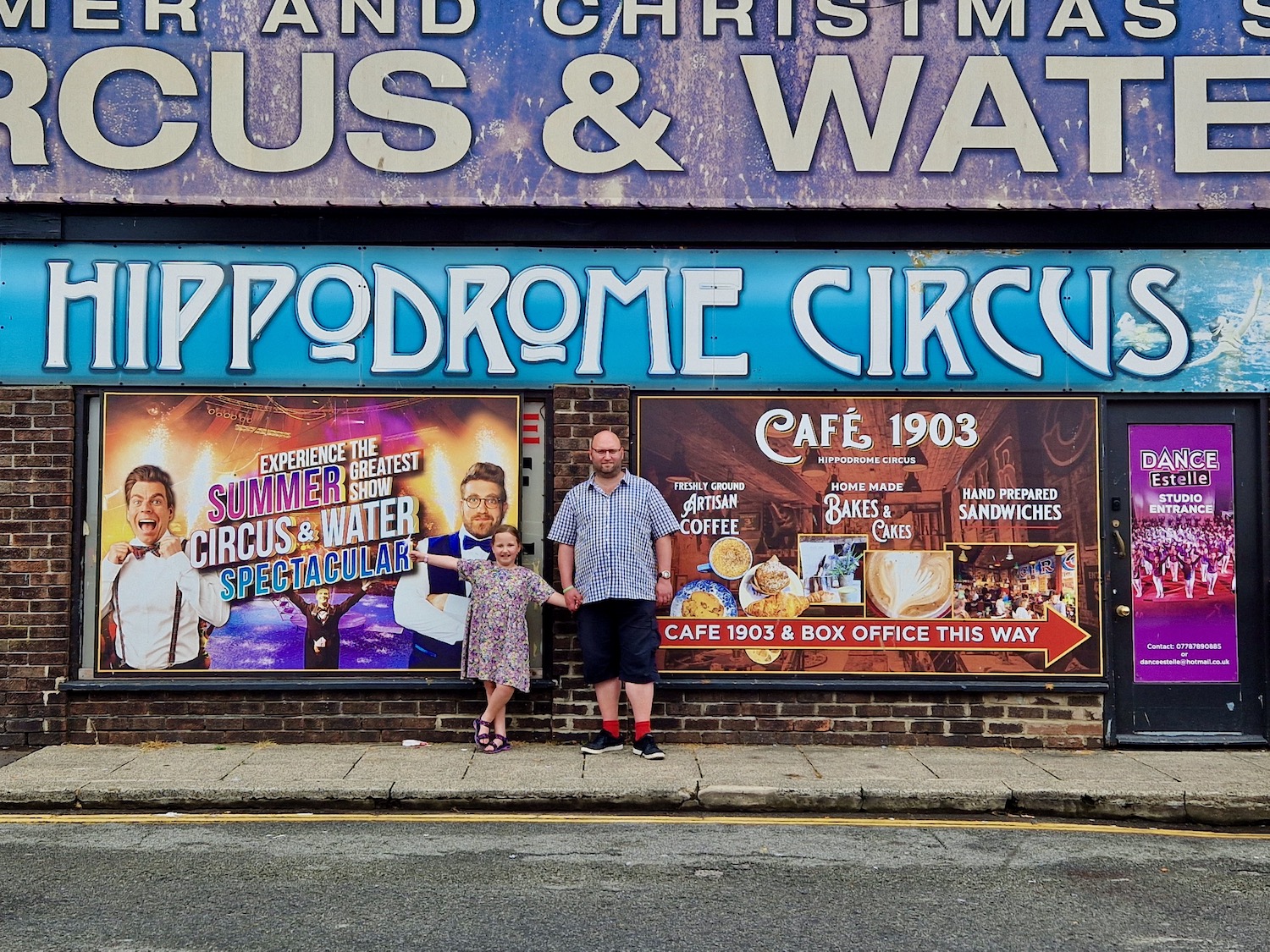 Dad and 7 year old daughter stood outside the Hippodrome in Great Yarmouth