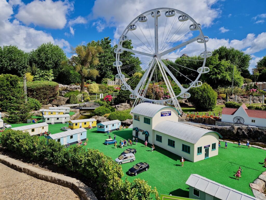 Model village caravan park with wheel in the background