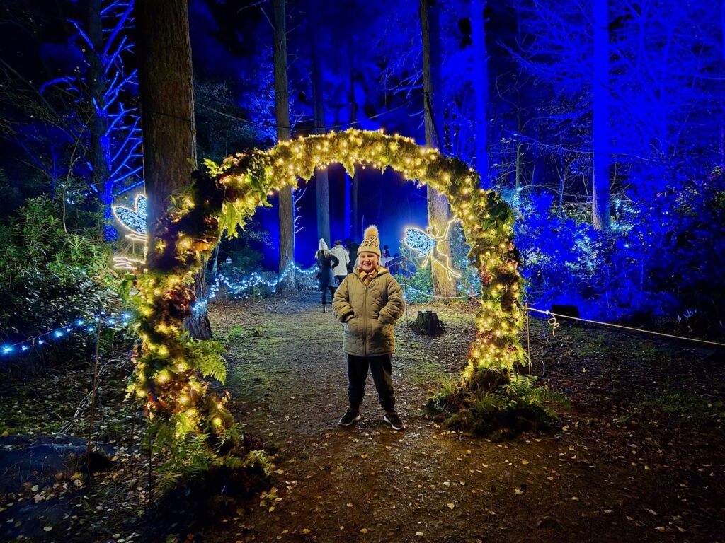 Erin under a light arch at Luminate Sandringham