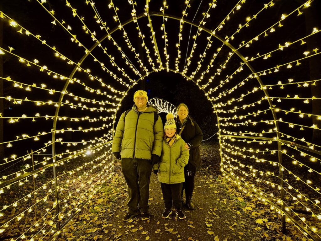 Family photo in the Luminate Sandringham light tunnel