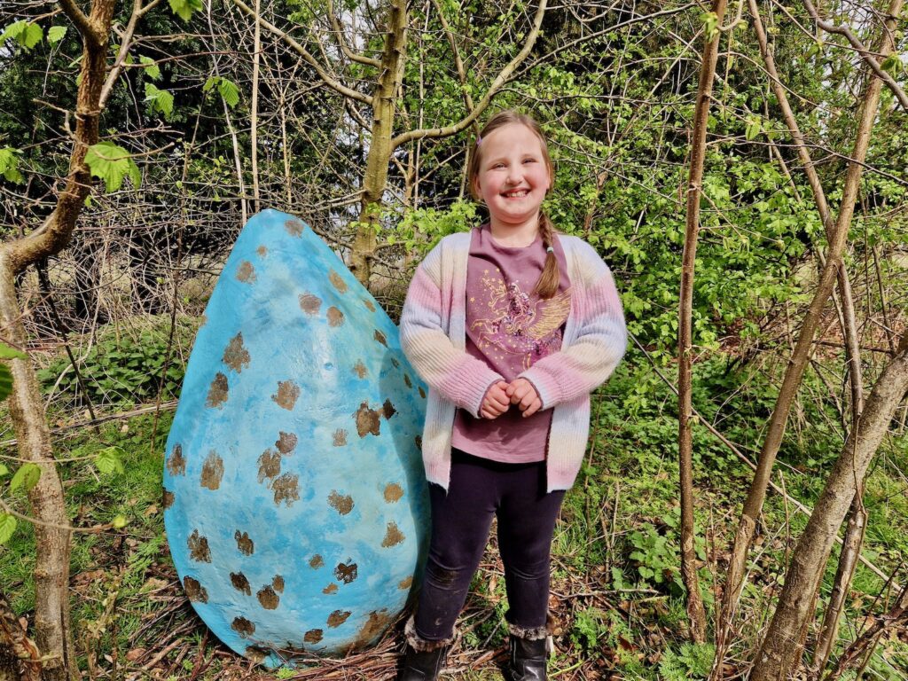 Easter at Pensthorpe - Erin next to a giant blue egg