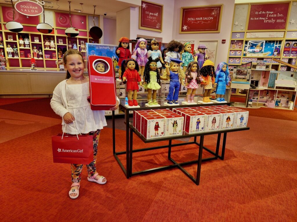 Erin in American Girl at the Florida Mall with her purchases