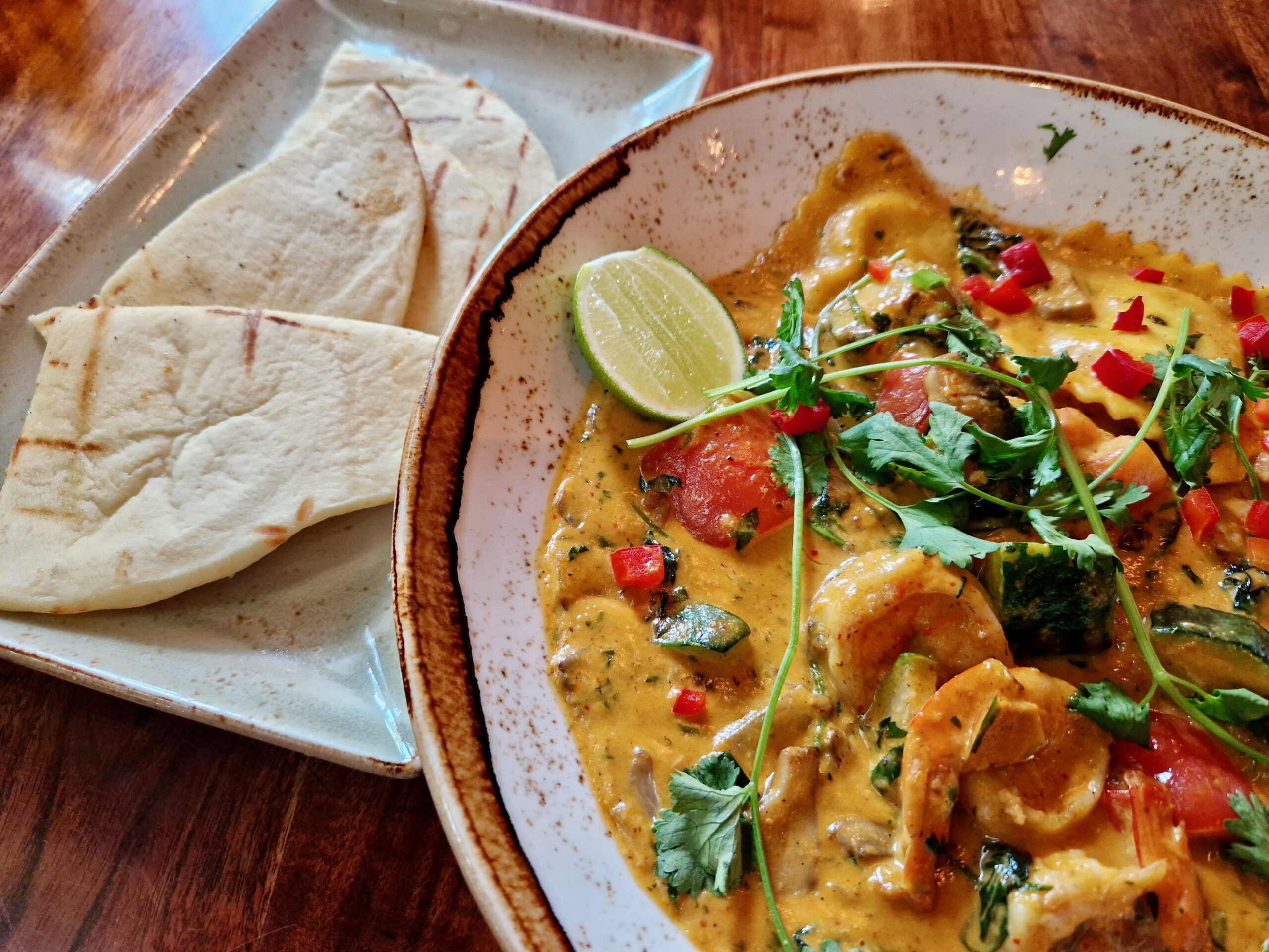 Malaysian Seafood Curry with a side of naan bread at Yak and Yeti Animal Kingdom