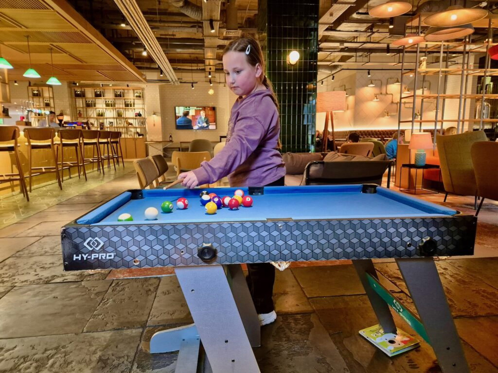 Erin playing pool at Novotel York