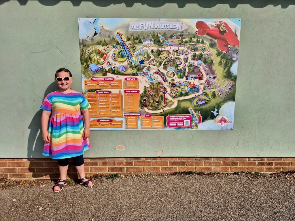 Erin with the park map at Pleasurewood Hills