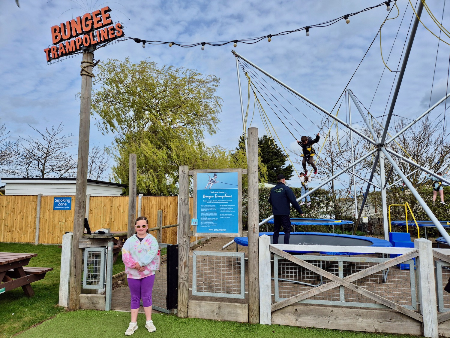 Child standing in front of the bungee trampolines at Haven Caister-on-Sea