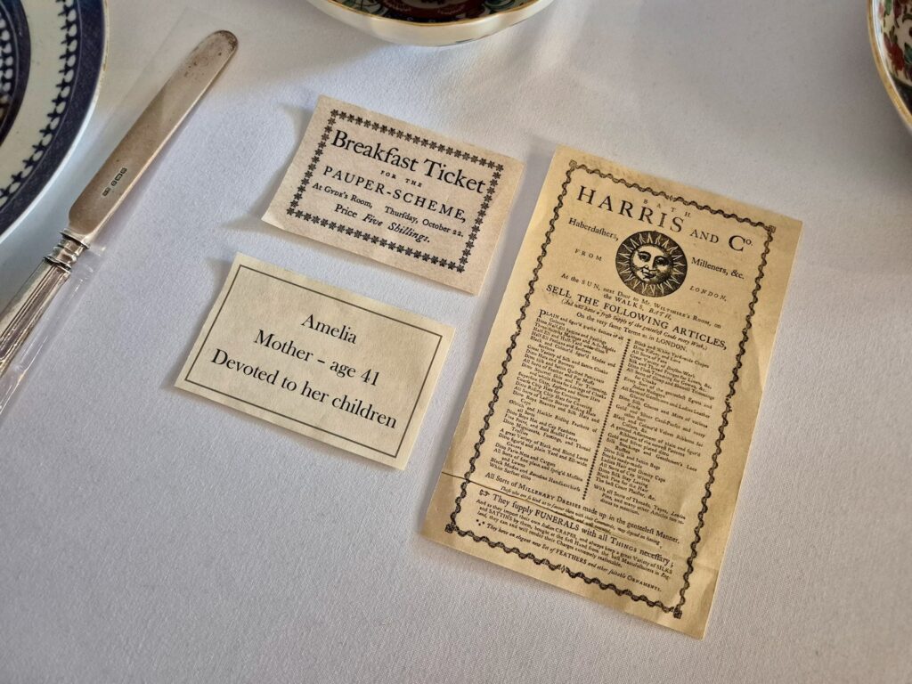 Historical display featuring a Georgian breakfast ticket and household items at No. 1 Royal Crescent in Bath