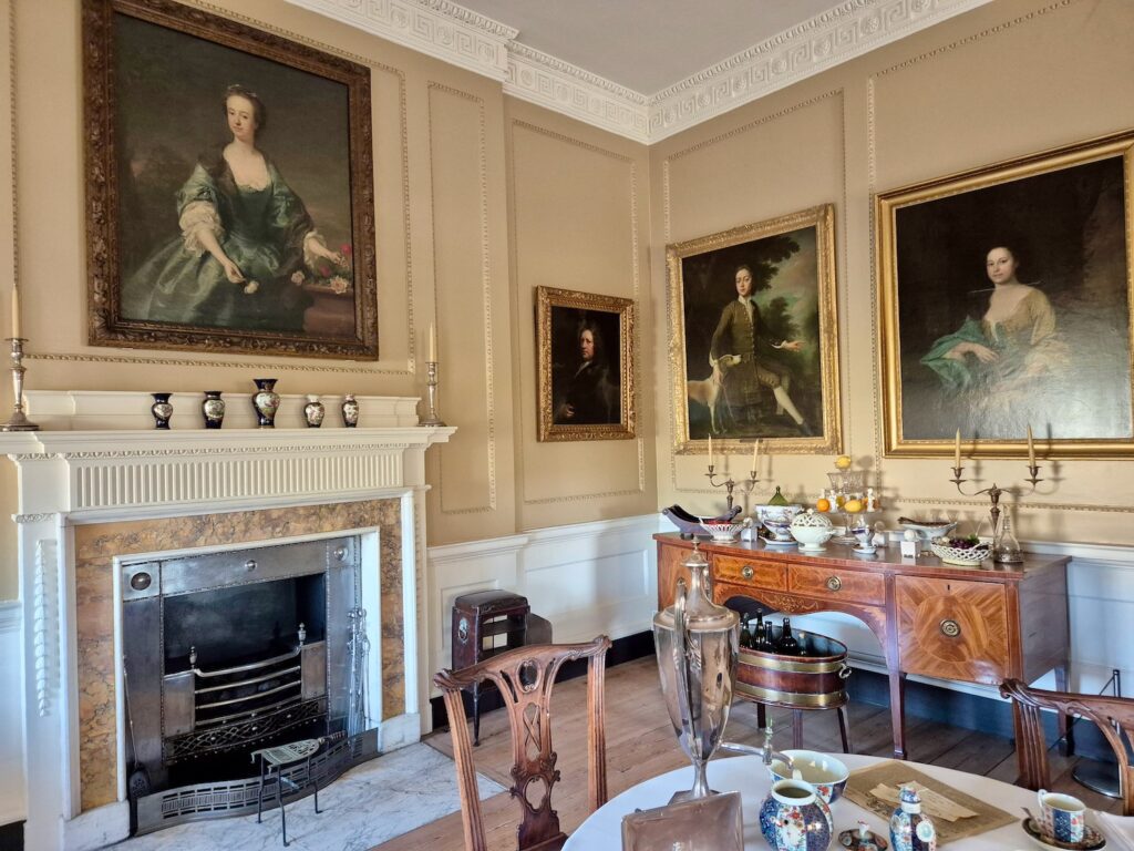 Elegant Georgian dining room with portraits, fireplace, and period furniture at No. 1 Royal Crescent in Bath