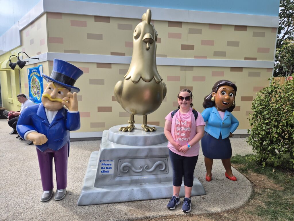 10 year old girl standing near Paw Patrol characters at Chessington