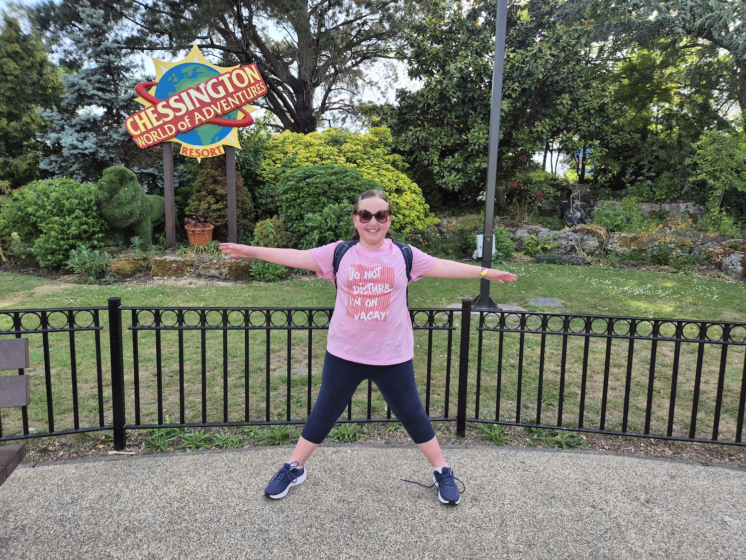 Young girl posing near the Chessington sign